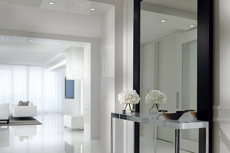 Bright, evenly lit modern interior with white walls and soft reflections