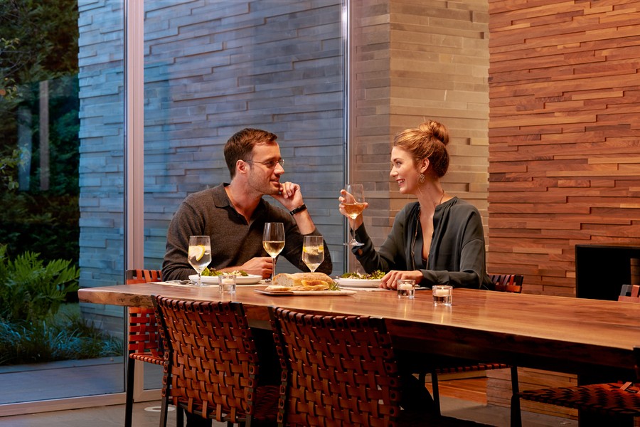 a couple having dinner on a dining table 