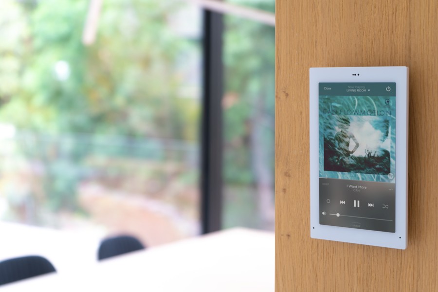 A wall-mounted Savant touch panel outside the dining room.  