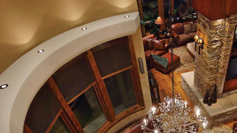 A bird’s eye view of a living area with Lutron motorized shades and lighting.