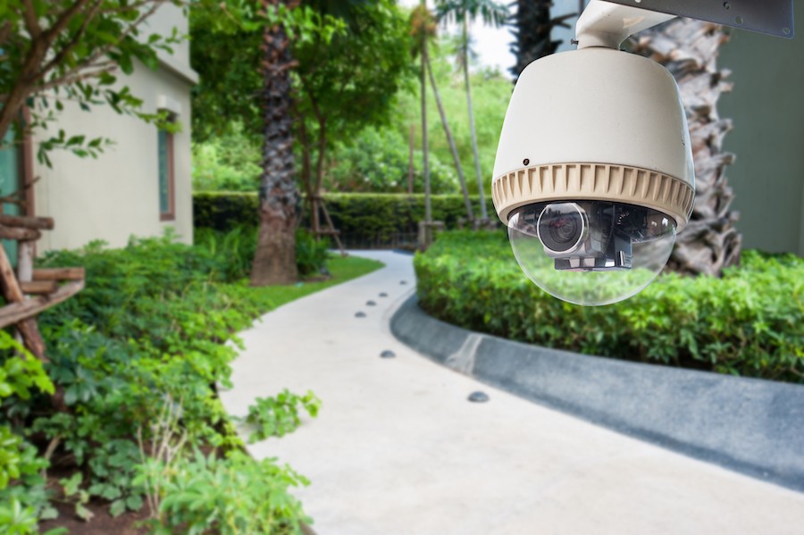 A security camera installed outside a modern home. 