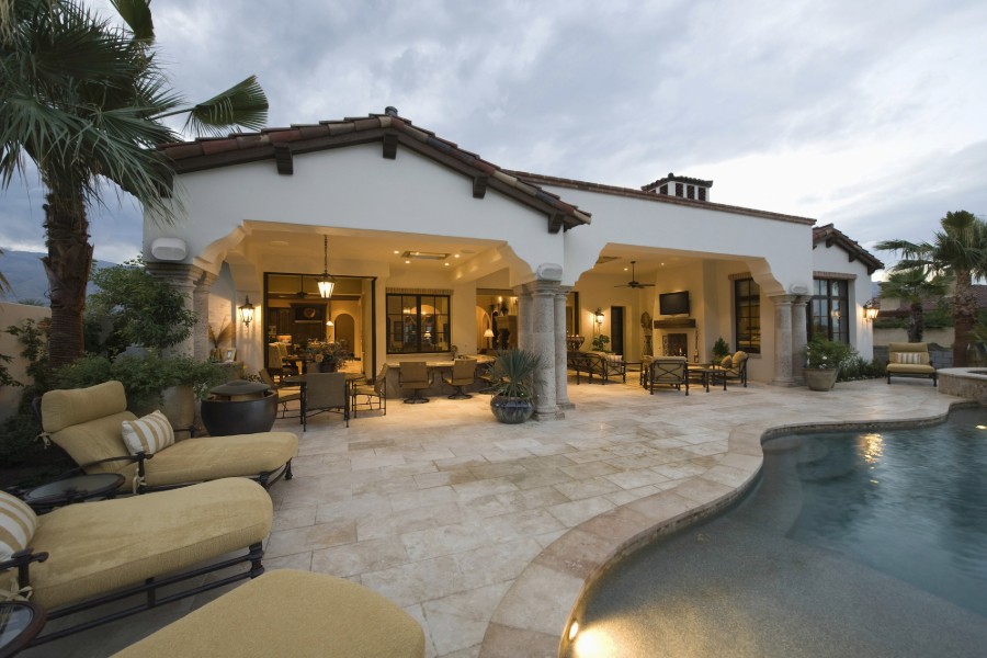 A serene pool and patio area with inviting lounge chairs.