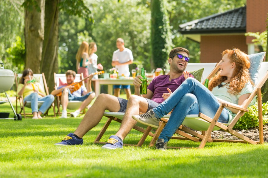 A backyard setting with friends socializing.